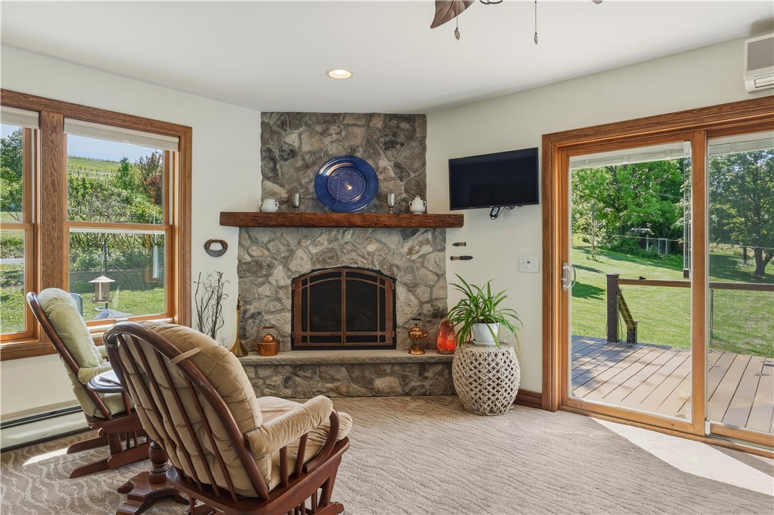 5580 Peach Orchard Road Hector, NY 14841 - Photo 12 of 50 Propane gas fireplace in natural stone featuring h