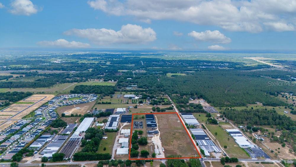 2045 West Kelly Park Road Apopka, FL 32712 - Photo 11 of 16 an aerial view of residential houses with outdoor space and street view