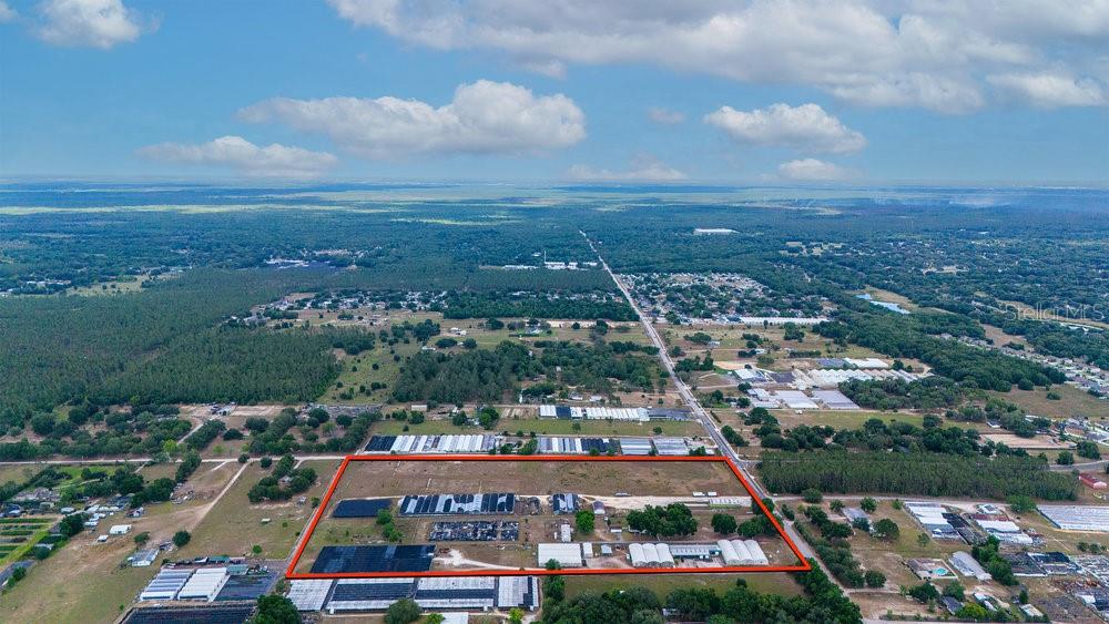 2045 West Kelly Park Road Apopka, FL 32712 - Photo 14 of 16 an aerial view of residential houses and lake
