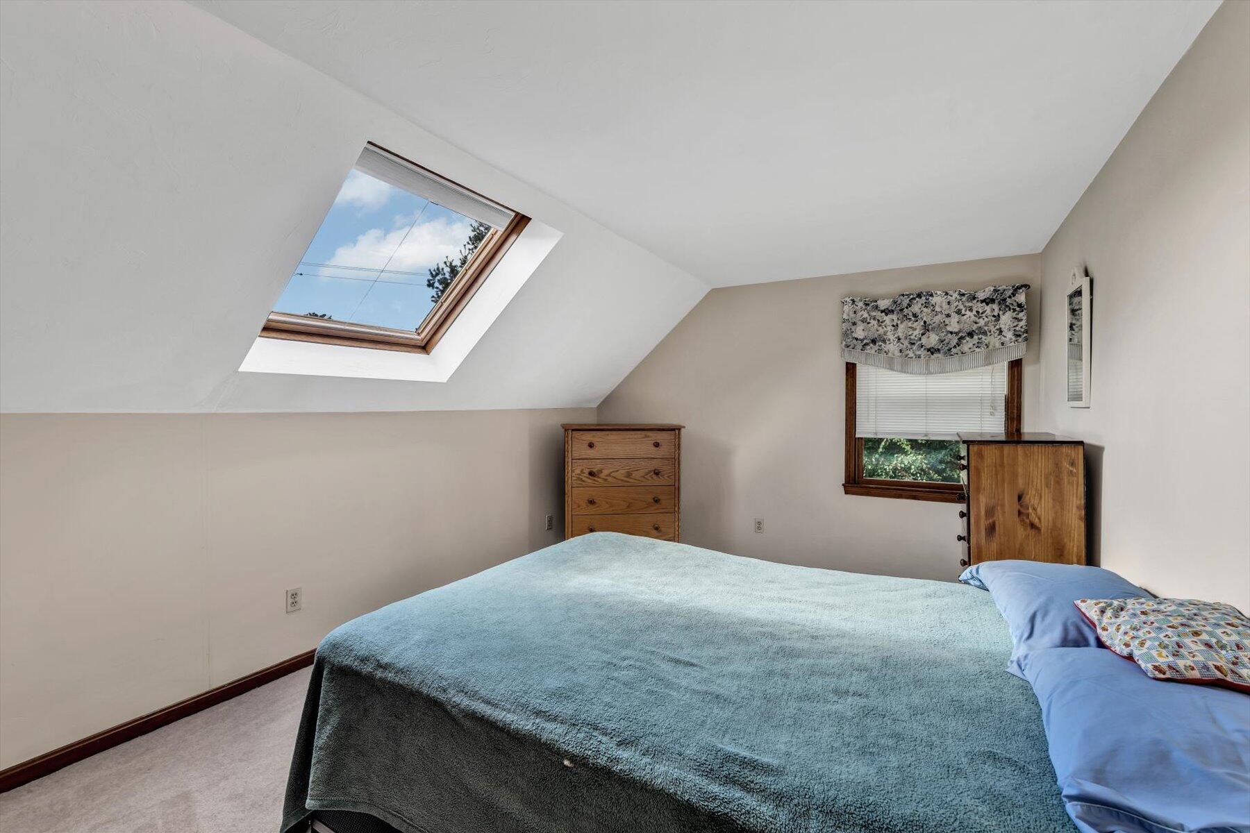 4 Surf Drive Mashpee, MA 02649 - Photo 12 of 22 a bedroom with a bed and painting on the wall