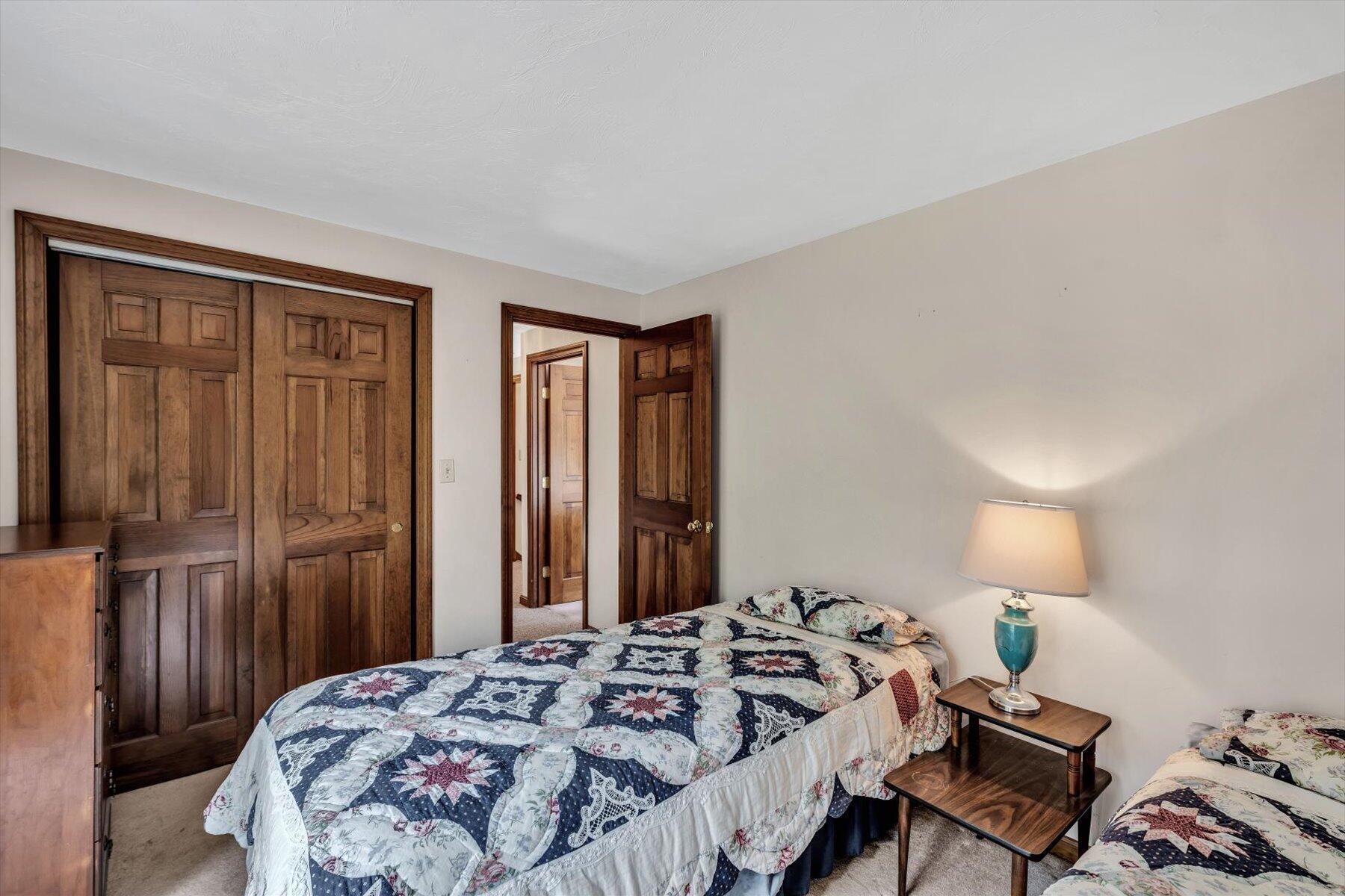 4 Surf Drive Mashpee, MA 02649 - Photo 13 of 22 a bedroom with a bed and wooden floor