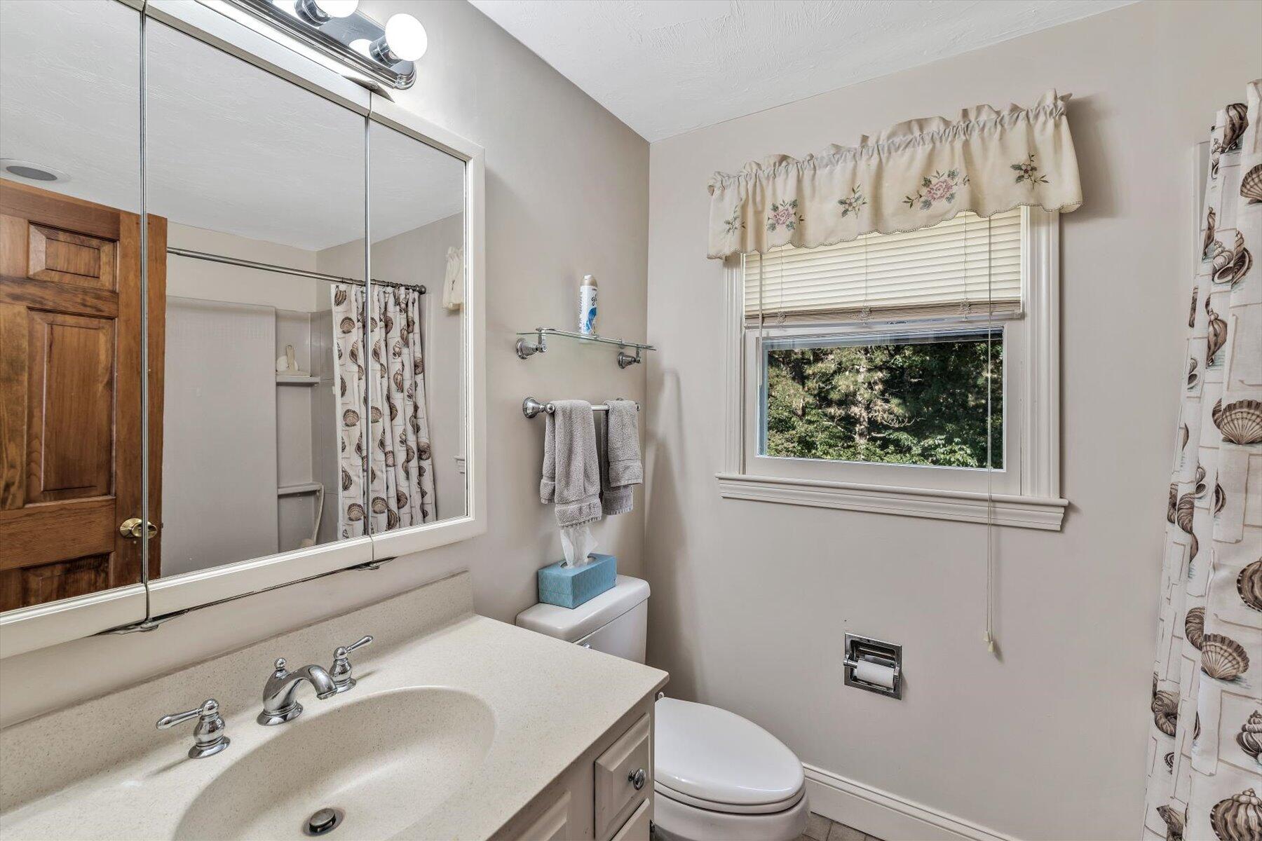 4 Surf Drive Mashpee, MA 02649 - Photo 14 of 22 a bathroom with a sink toilet and shower