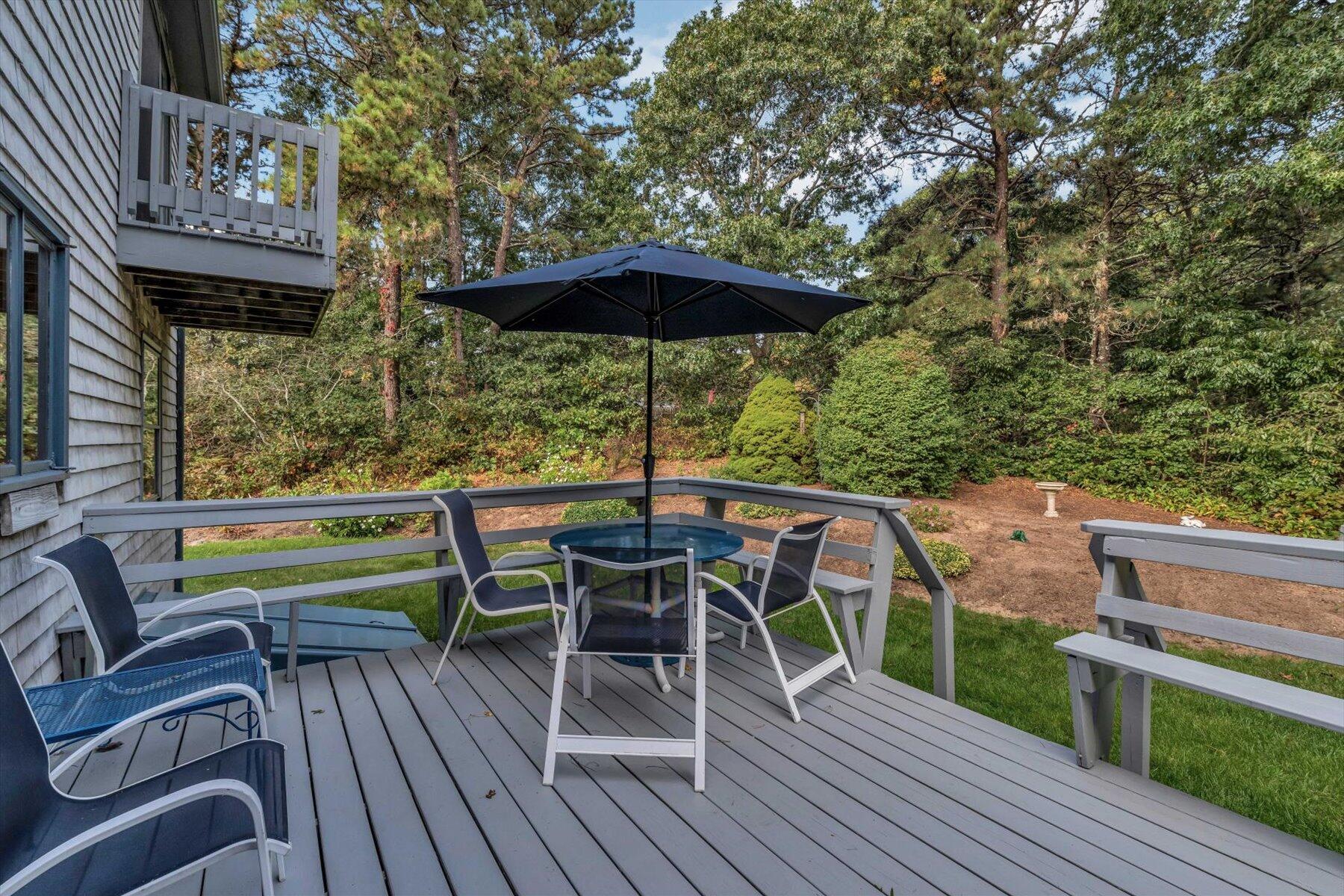 4 Surf Drive Mashpee, MA 02649 - Photo 17 of 22 a view of a chairs and table on the wooden floor
