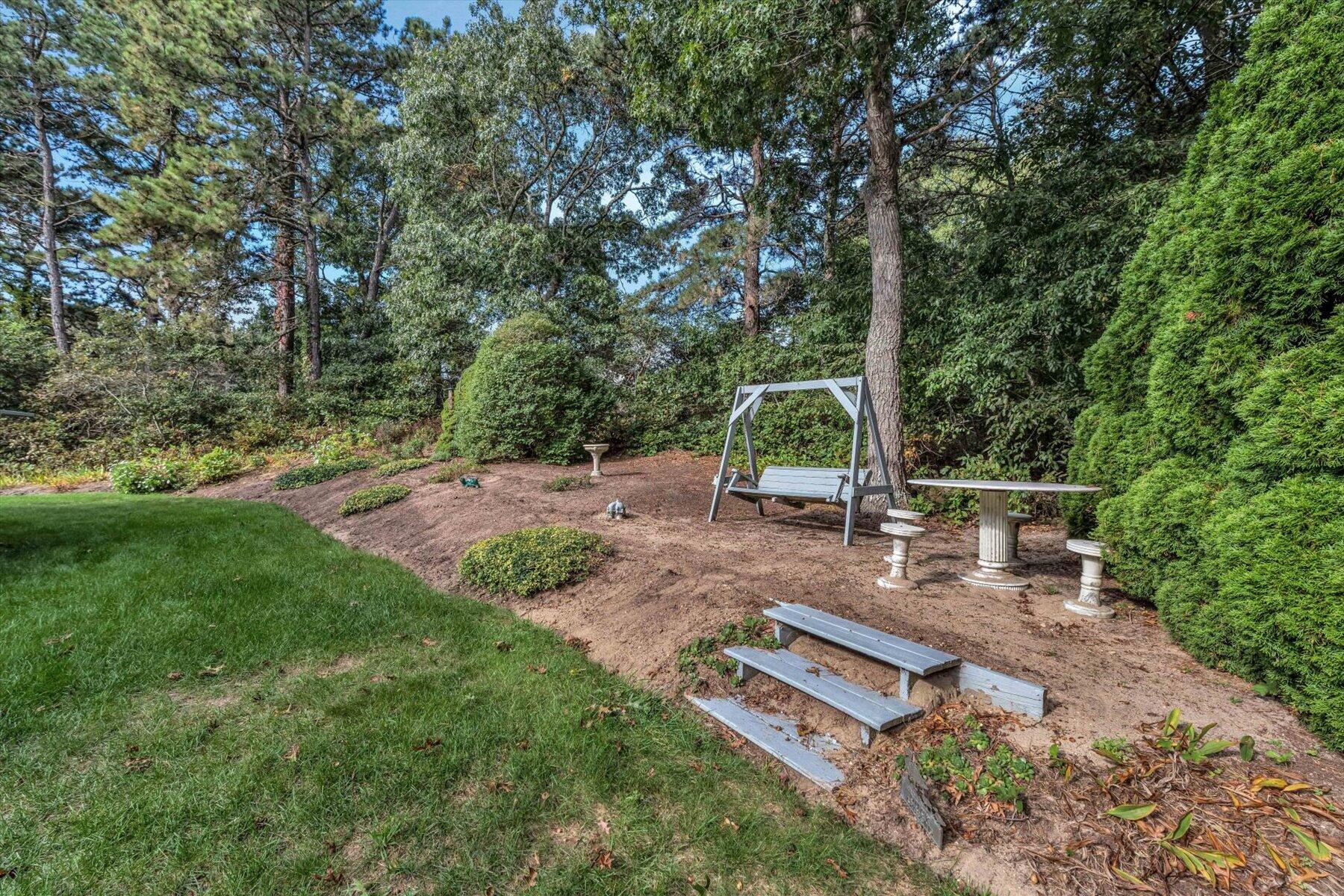 4 Surf Drive Mashpee, MA 02649 - Photo 20 of 22 a view of a backyard with sitting area