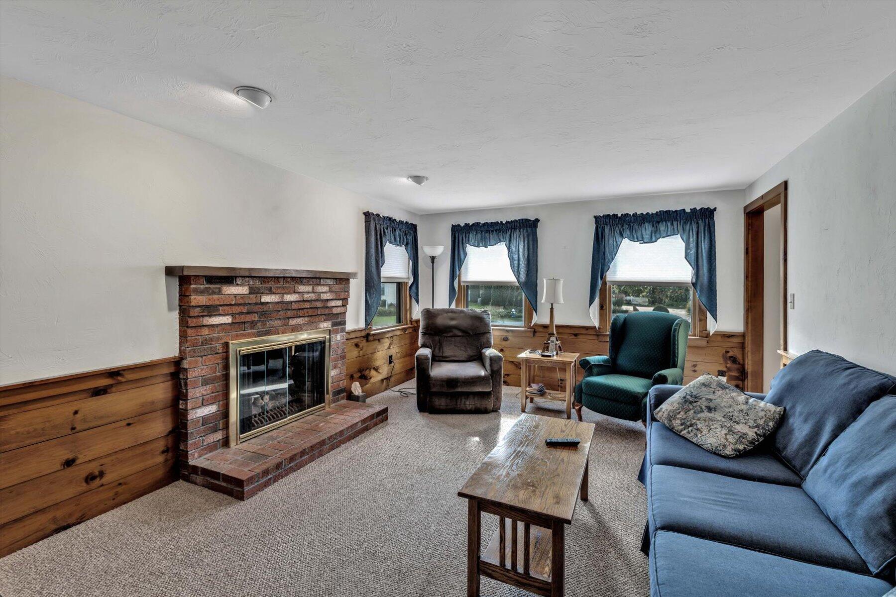 4 Surf Drive Mashpee, MA 02649 - Photo 4 of 22 a living room with furniture and a fireplace