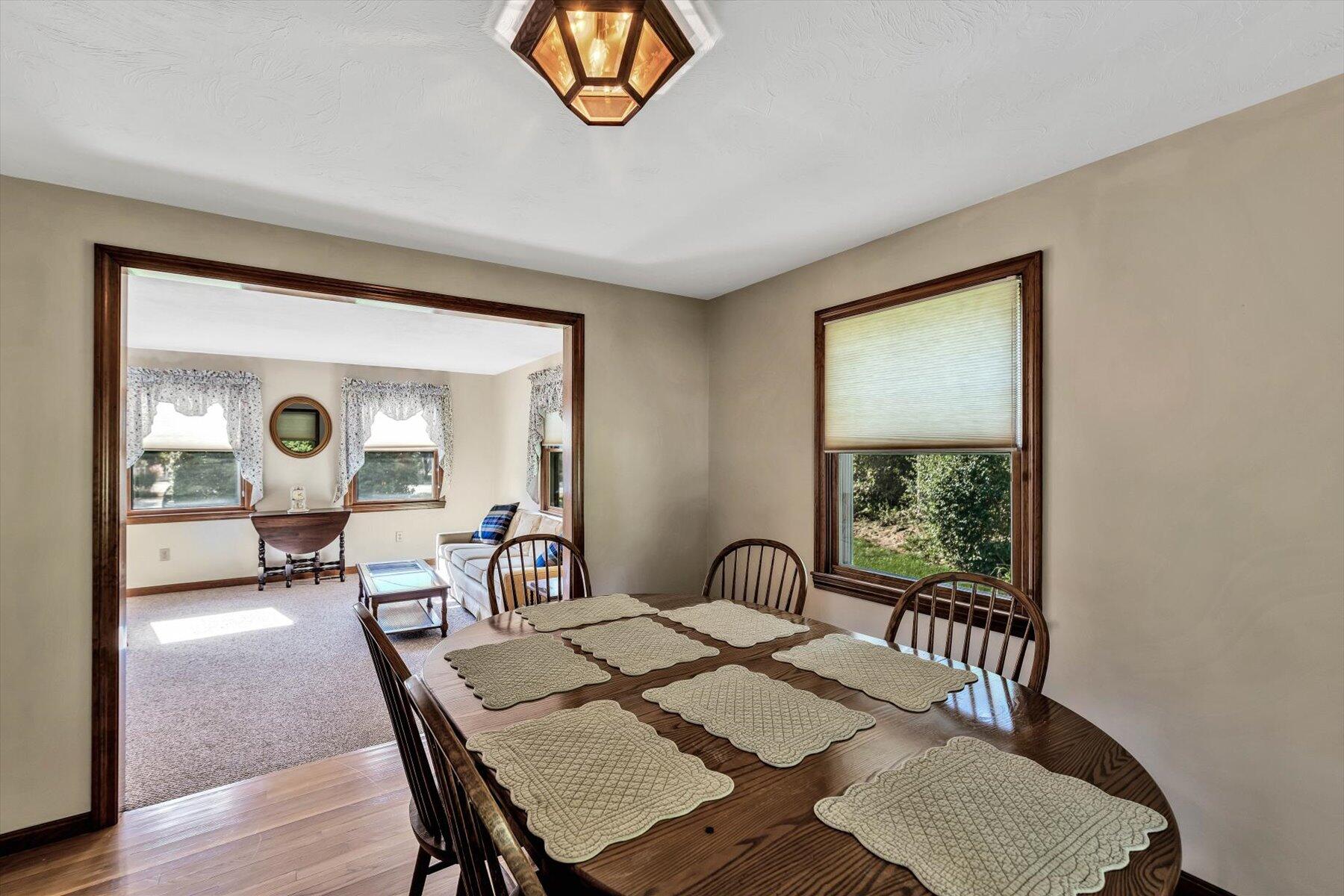 4 Surf Drive Mashpee, MA 02649 - Photo 5 of 22 a view of a dining room with furniture window and outside view