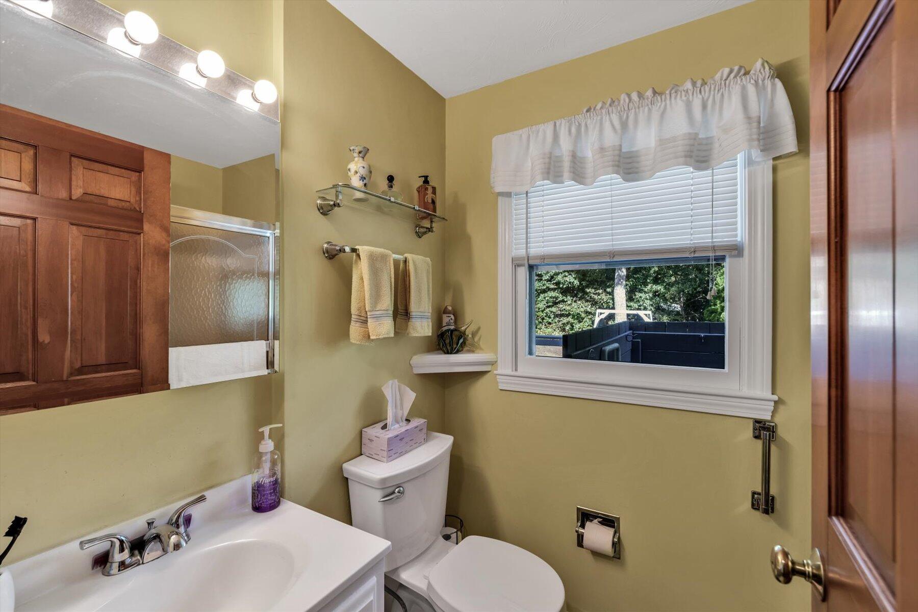 4 Surf Drive Mashpee, MA 02649 - Photo 8 of 22 a bathroom with a sink a toilet and shower