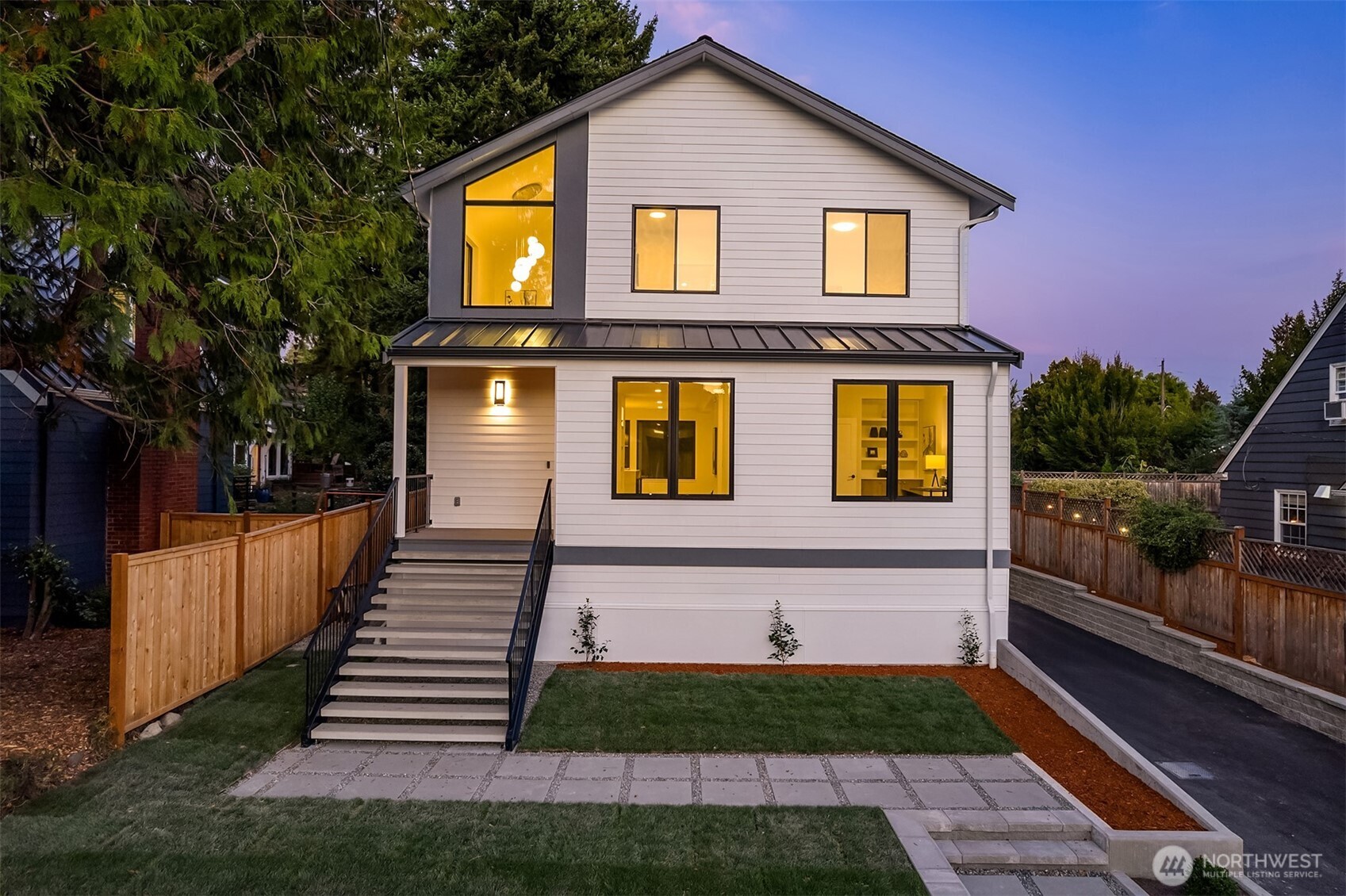 6214 40th Avenue Northeast Seattle, WA 98115 - Photo 1 of 40 a front view of a house with a yard
