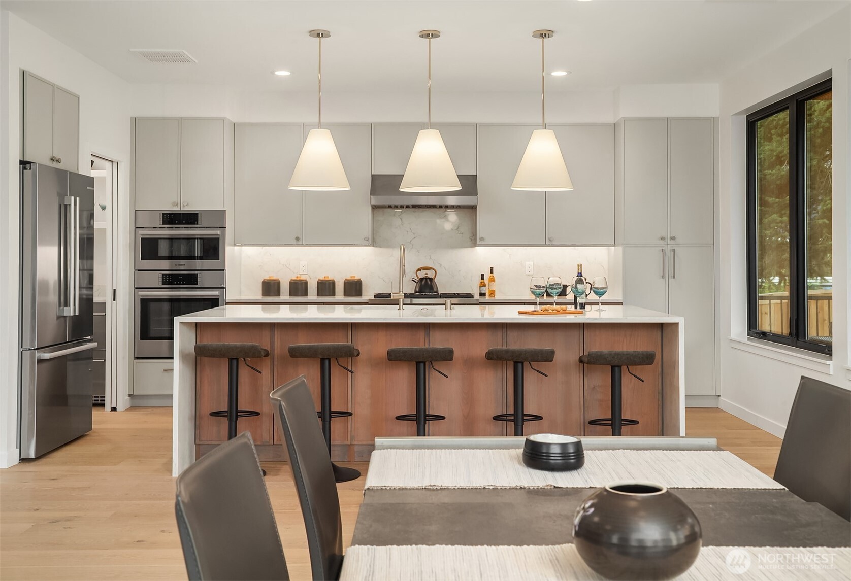 6214 40th Avenue Northeast Seattle, WA 98115 - Photo 11 of 40 a kitchen with stainless steel appliances granite countertop a sink a stove and a refrigerator