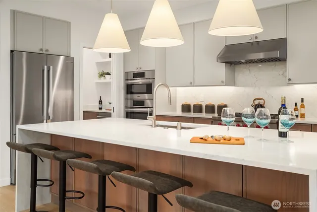 a kitchen with a table and chairs in it