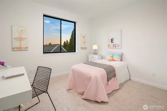 a bedroom with a bed and a chair