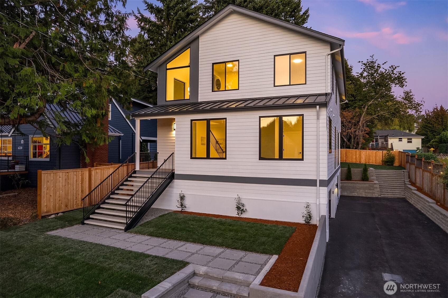 6214 40th Avenue Northeast Seattle, WA 98115 - Photo 2 of 40 a front view of a house with a yard