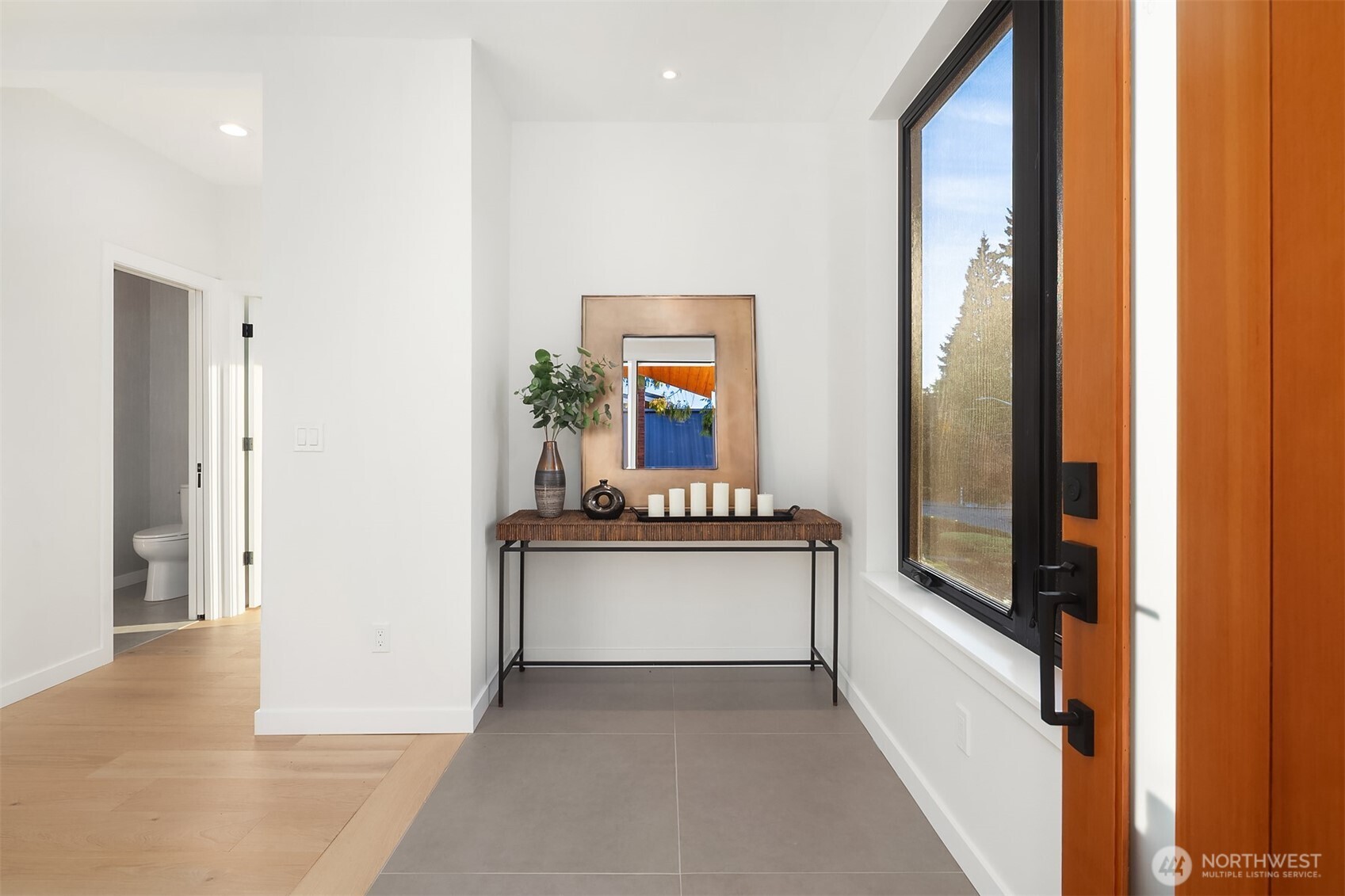 6214 40th Avenue Northeast Seattle, WA 98115 - Photo 3 of 40 a living room with stainless steel appliances granite countertop furniture and a gate