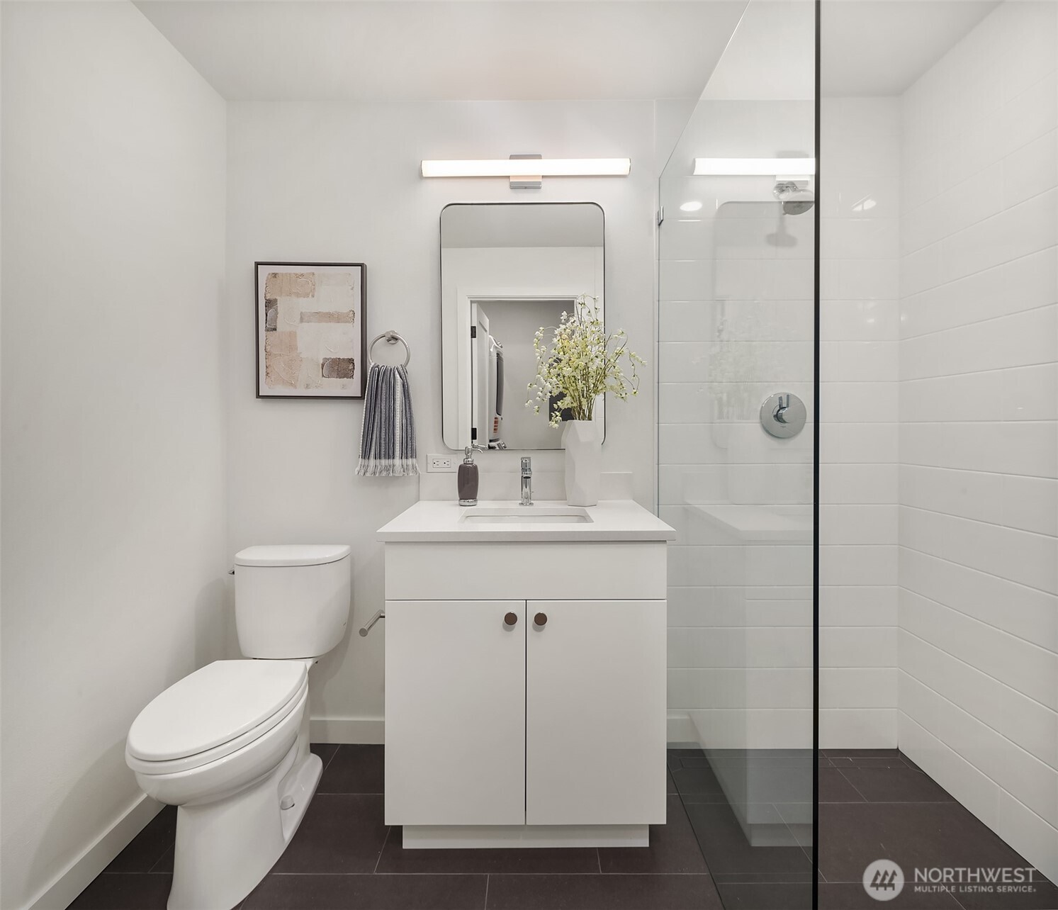 6214 40th Avenue Northeast Seattle, WA 98115 - Photo 34 of 40 a bathroom with a toilet sink and mirror