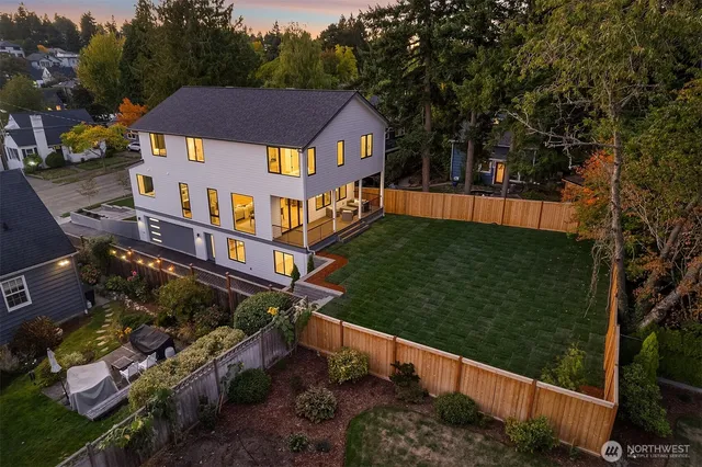 a view of a house with backyard and porch