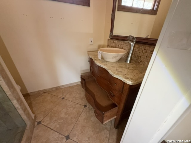 15005 Broken Bow Trail Austin, TX 78734 - Photo 12 of 13 a bathroom with a sink and mirror