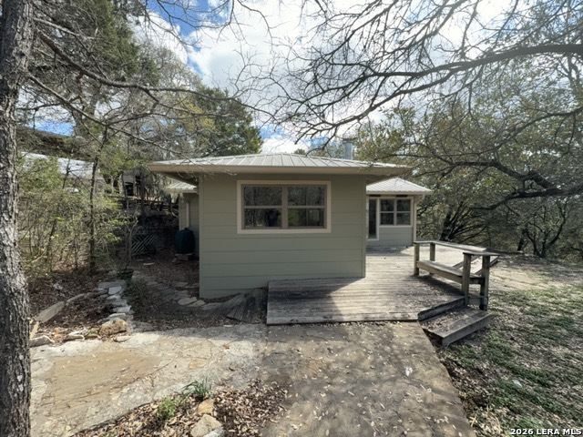 15005 Broken Bow Trail Austin, TX 78734 - Photo 2 of 13 a view of a house with backyard and chairs
