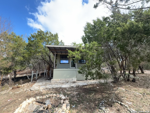 15005 Broken Bow Trail Austin, TX 78734 - Photo 3 of 13 a view of house with outdoor space and sitting area