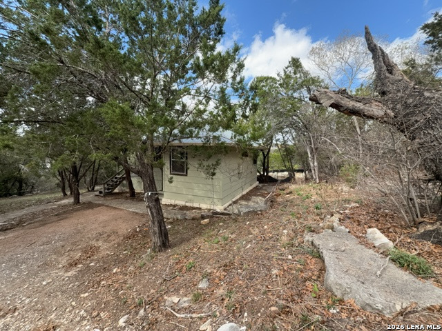 15005 Broken Bow Trail Austin, TX 78734 - Photo 4 of 13 a view of a tree in a yard