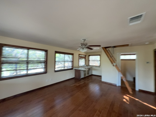 15005 Broken Bow Trail Austin, TX 78734 - Photo 8 of 13 wooden floor in an empty room with a window