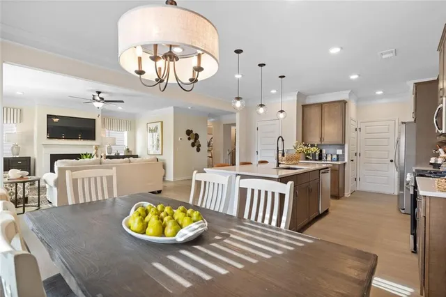 a kitchen with a sink stainless steel appliances and cabinets