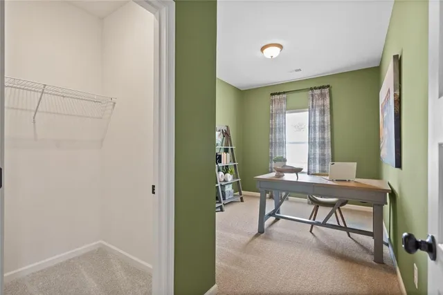 a reading room with furniture and a window