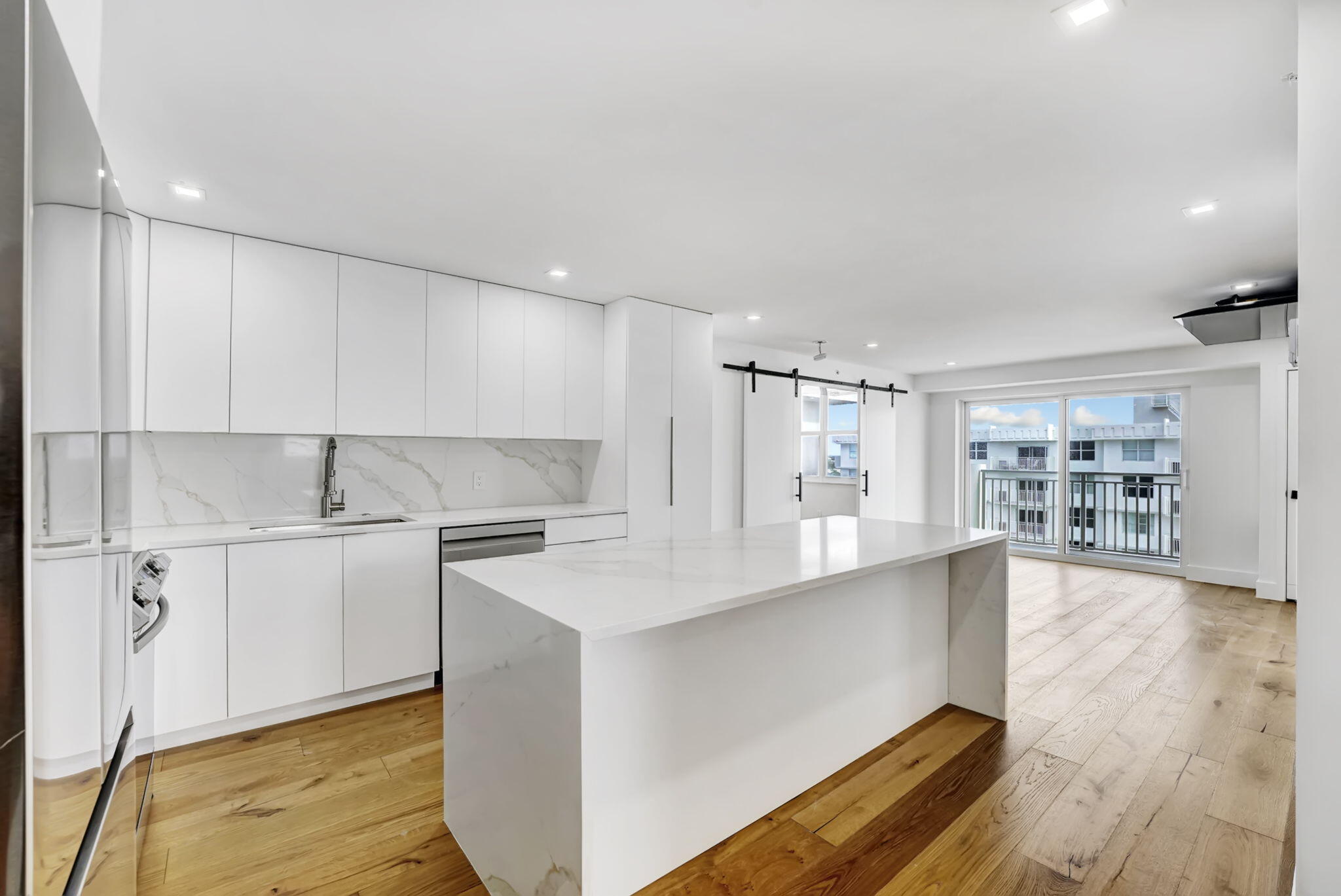 4511 South Ocean Boulevard, Unit 1008 Highland Beach, FL 33487 - Photo 1 of 32 a kitchen with stainless steel appliances granite countertop a sink and cabinets