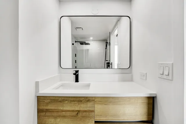 a bathroom with a sink and a mirror