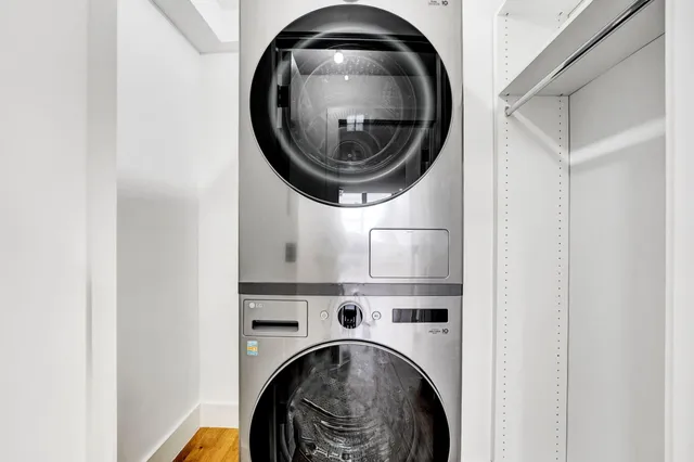 a view of a hallway with washer and dryer