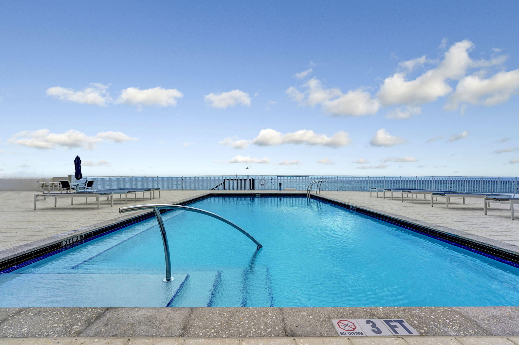 4511 South Ocean Boulevard, Unit 1008 Highland Beach, FL 33487 - Photo 25 of 32 a view of a swimming pool and an outdoor seating
