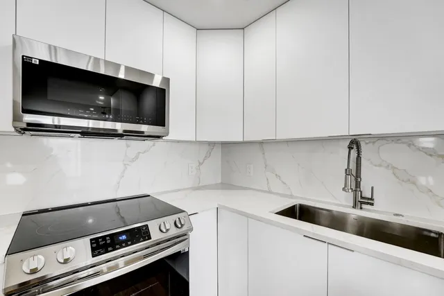 a kitchen with a stove and a microwave