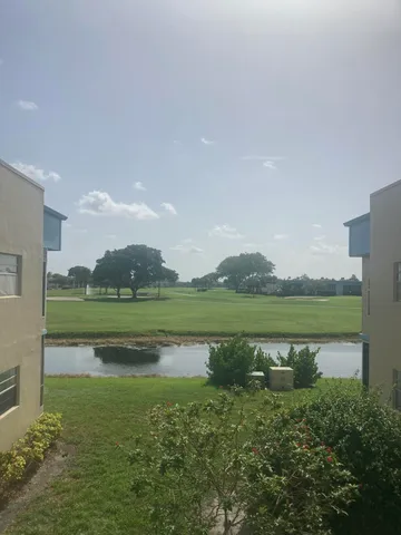 a view of a lake with a house in the background