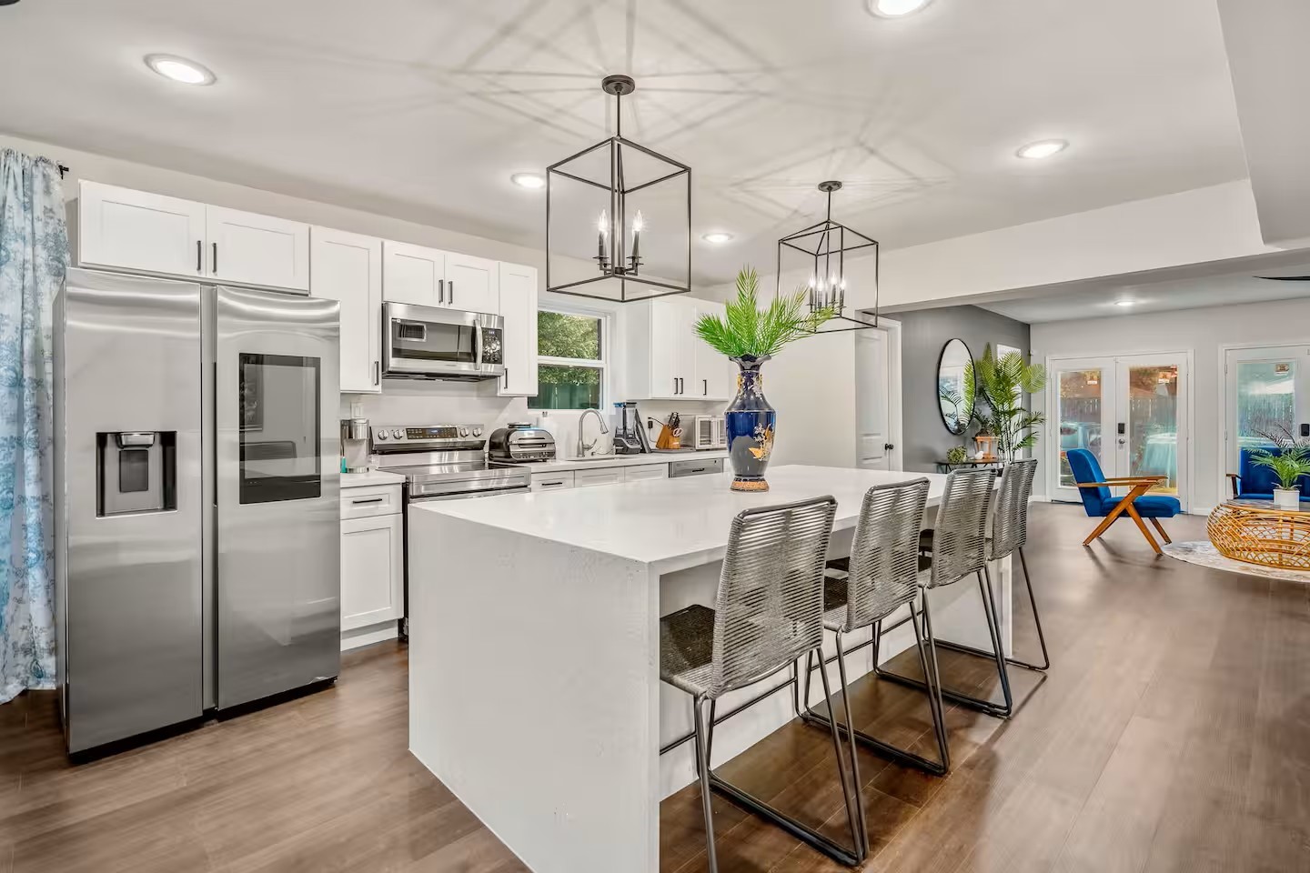 3741 Charleston Street Houston, TX 77021 - Photo 13 of 37 Sleek remodeled kitchen featuring new cabinets, quartz cabinets, tile backsplash, and stainless-steel appliances.