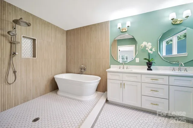 a bathroom with a double vanity sink mirror and