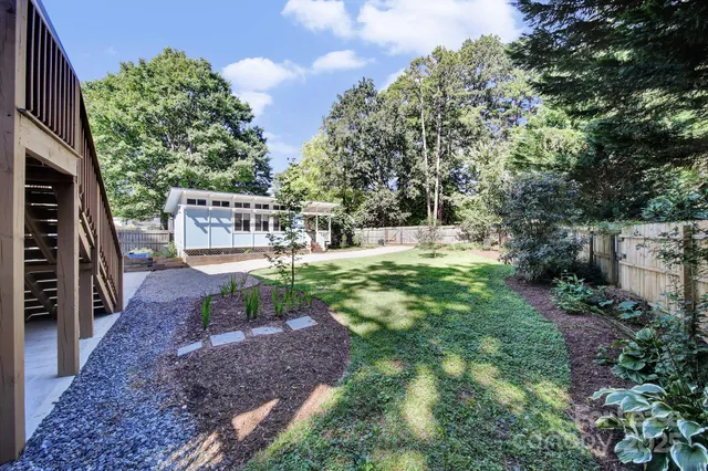 a view of a yard with a slide