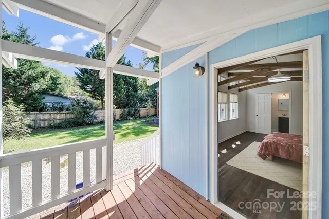 a view of balcony and yard