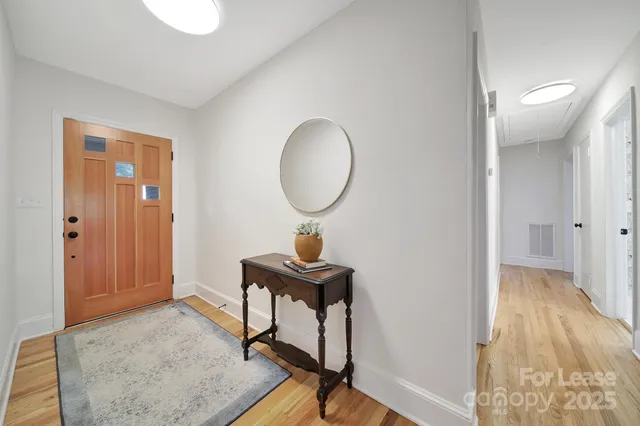 a view of a livingroom with furniture and wooden floor