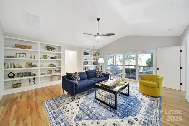 a living room with furniture and a rug