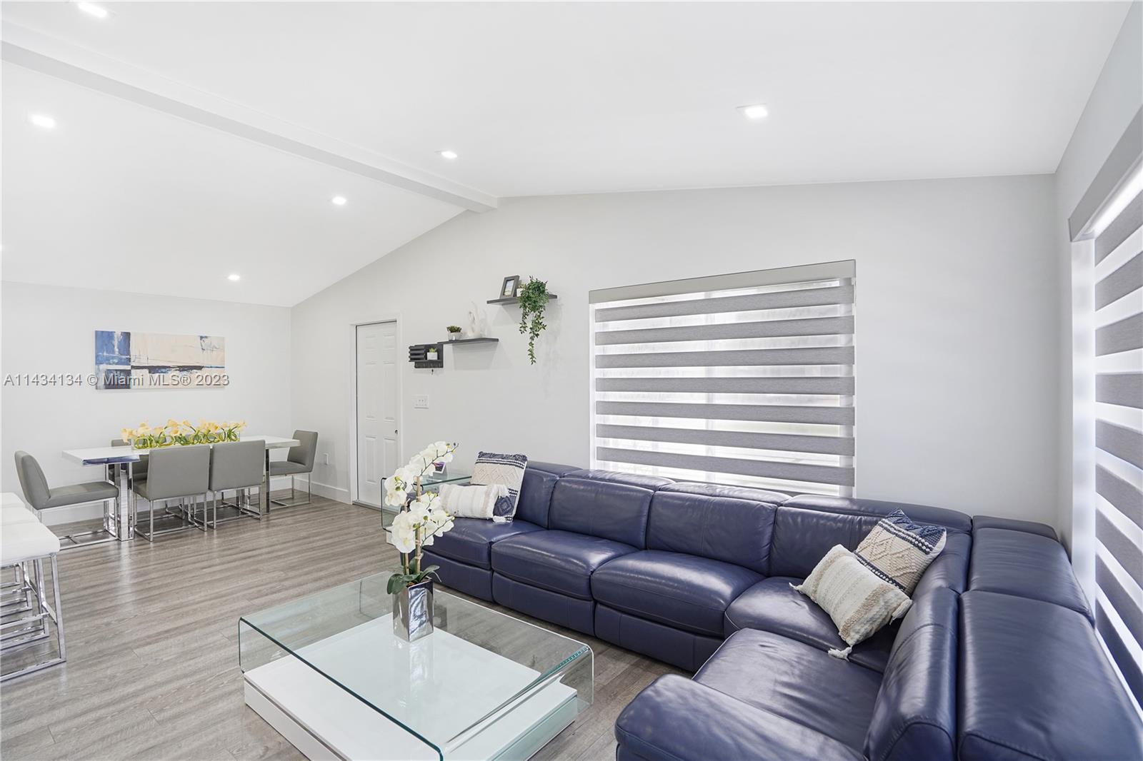 690 Southeast 3rd Place Hialeah, FL 33010 - Photo 14 of 31 a living room with furniture and wooden floor