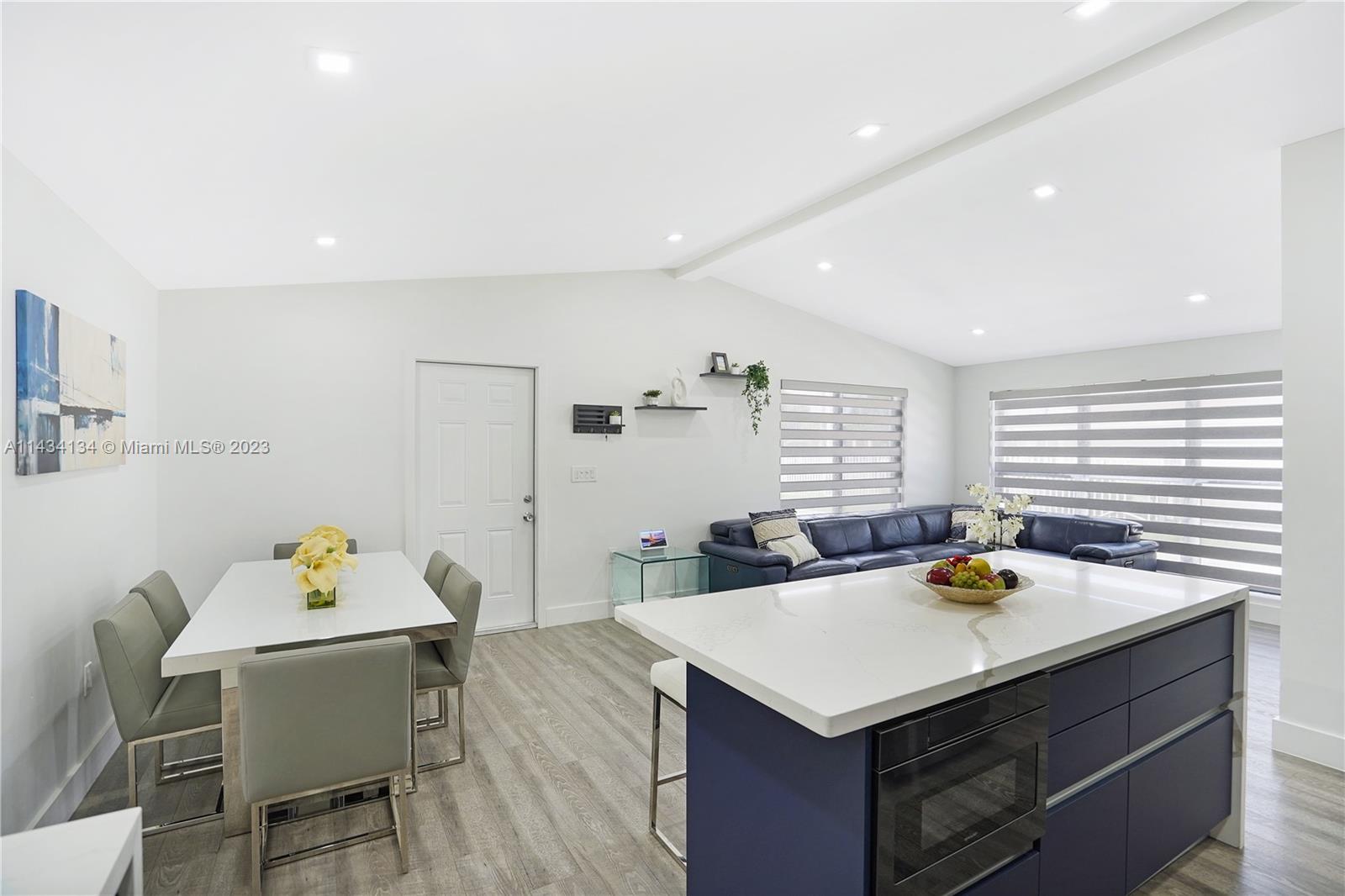 690 Southeast 3rd Place Hialeah, FL 33010 - Photo 17 of 31 a kitchen that has a table and chairs in it