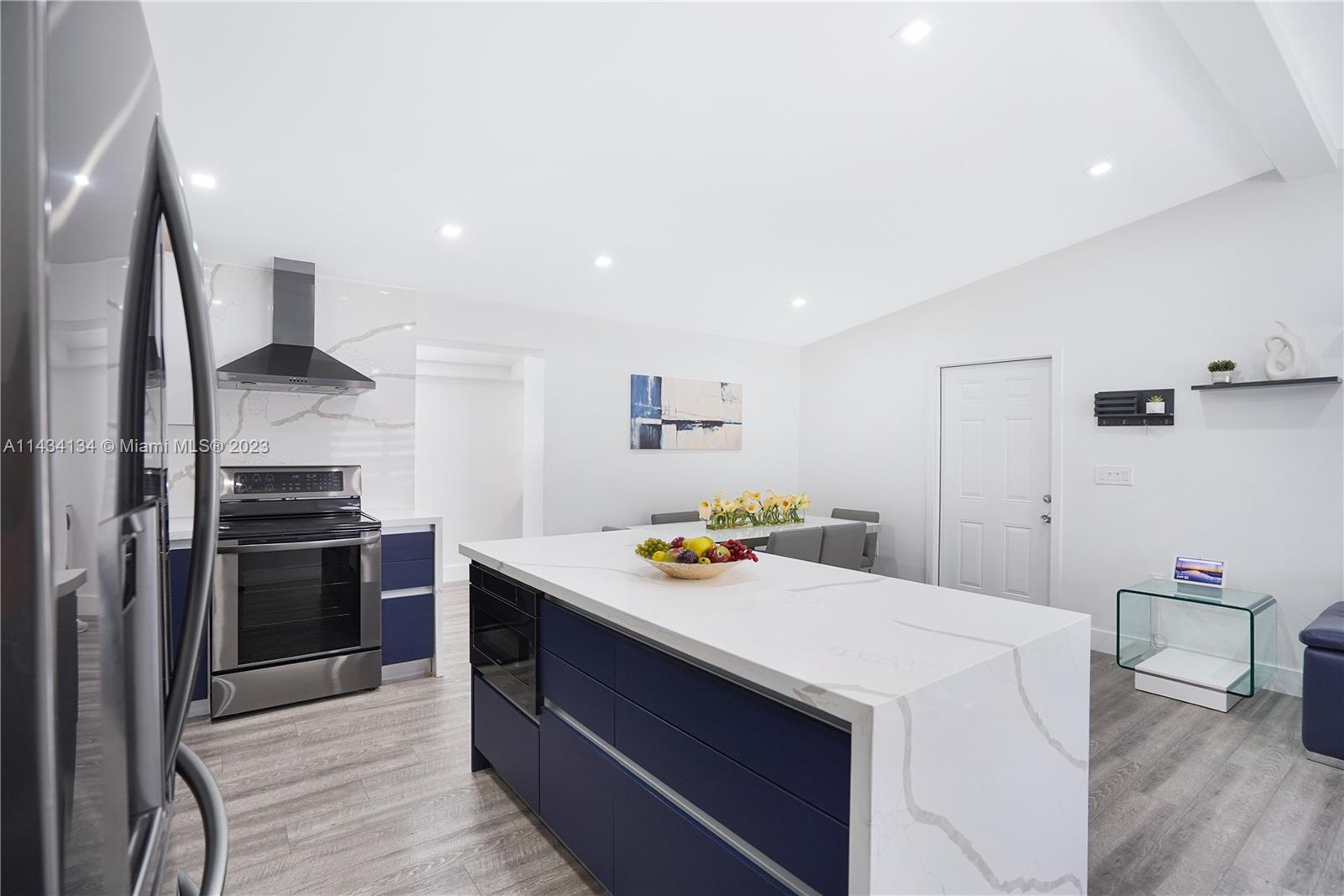 690 Southeast 3rd Place Hialeah, FL 33010 - Photo 18 of 31 a kitchen that has a sink and a stove