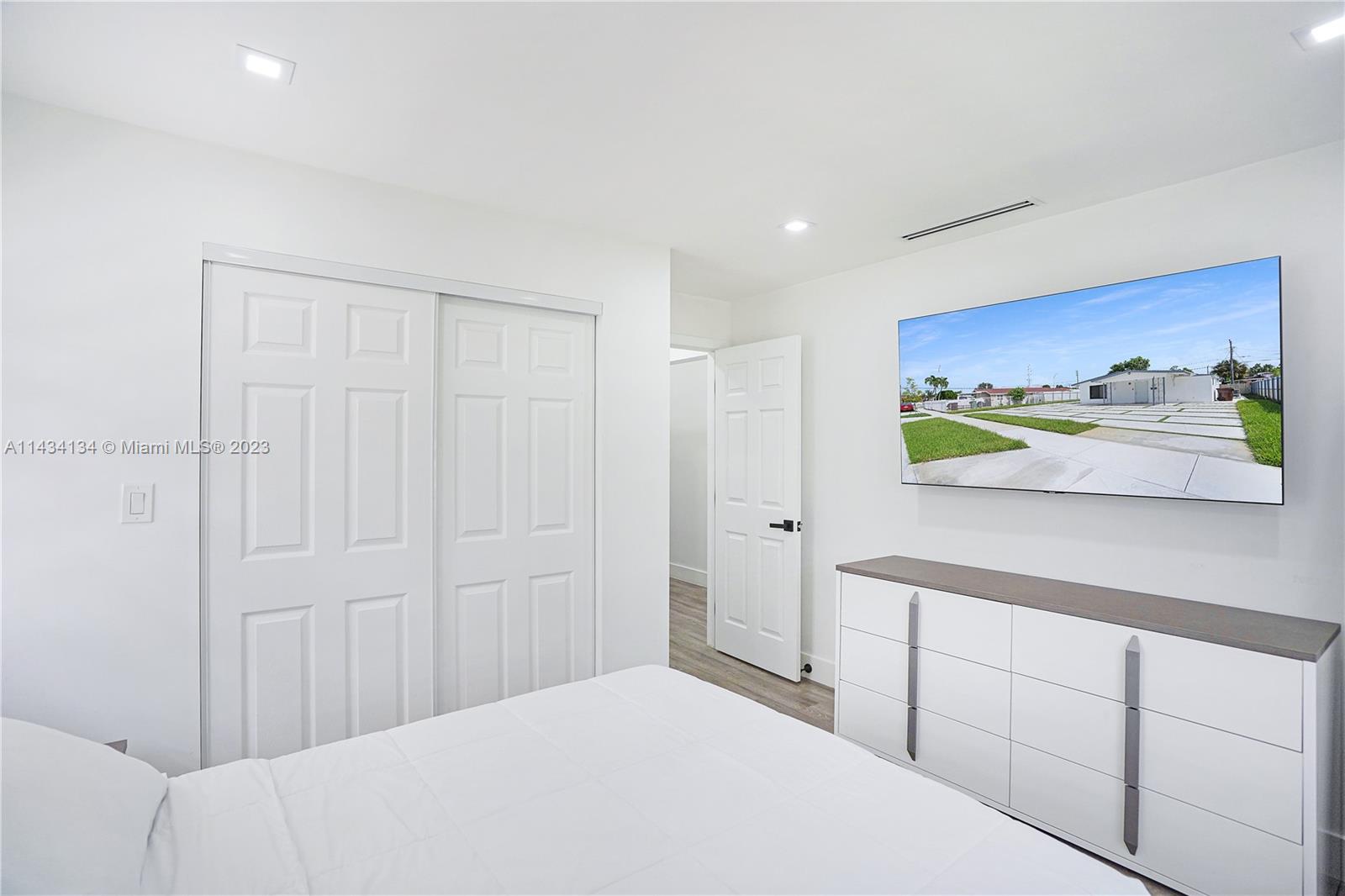 690 Southeast 3rd Place Hialeah, FL 33010 - Photo 28 of 31 a bedroom with a bed and a cabinets