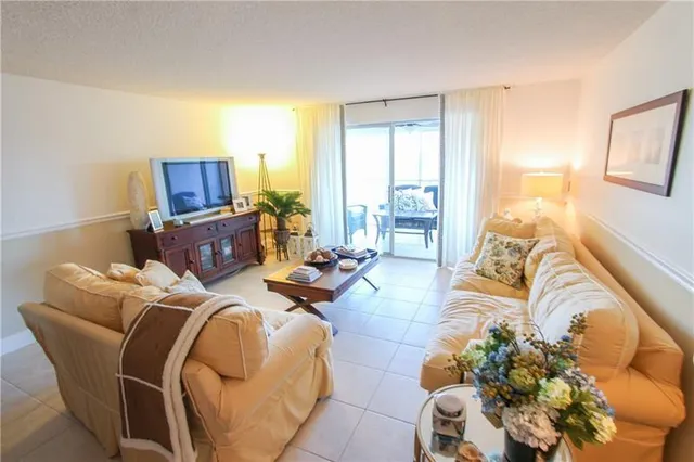 a bedroom with furniture and a flat screen tv