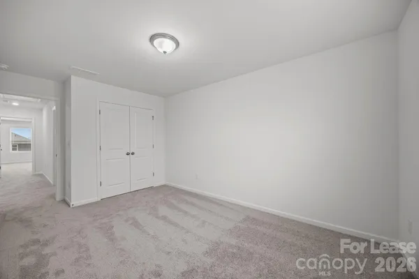 an empty room with a empty space and window