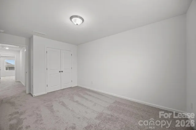 an empty room with a empty space and window