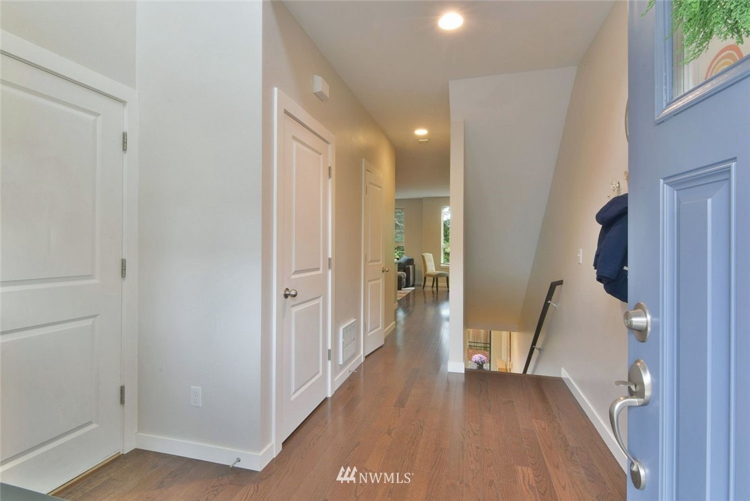 16517 2nd Park Southeast Bothell, WA 98012 - Photo 2 of 22 a view of a hallway with wooden floor and a living room