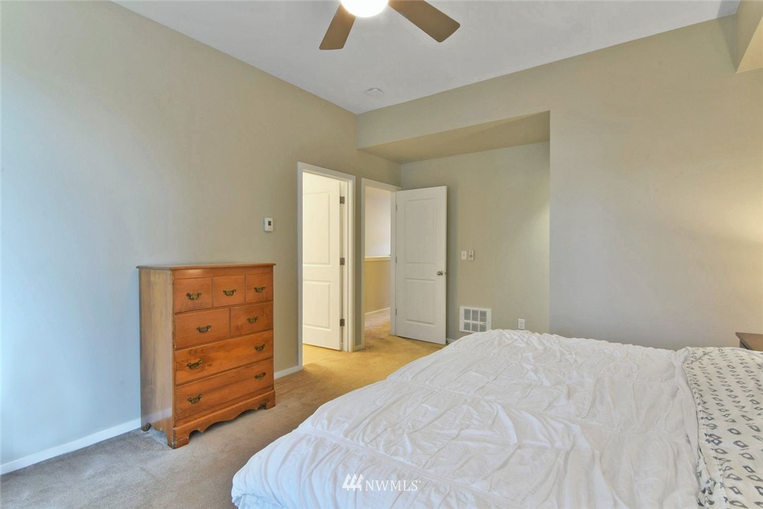 16517 2nd Park Southeast Bothell, WA 98012 - Photo 11 of 22 a bedroom with a bed and a dresser