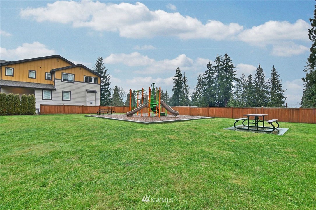 16517 2nd Park Southeast Bothell, WA 98012 - Photo 22 of 22 a view of a house with a big yard and a fountain