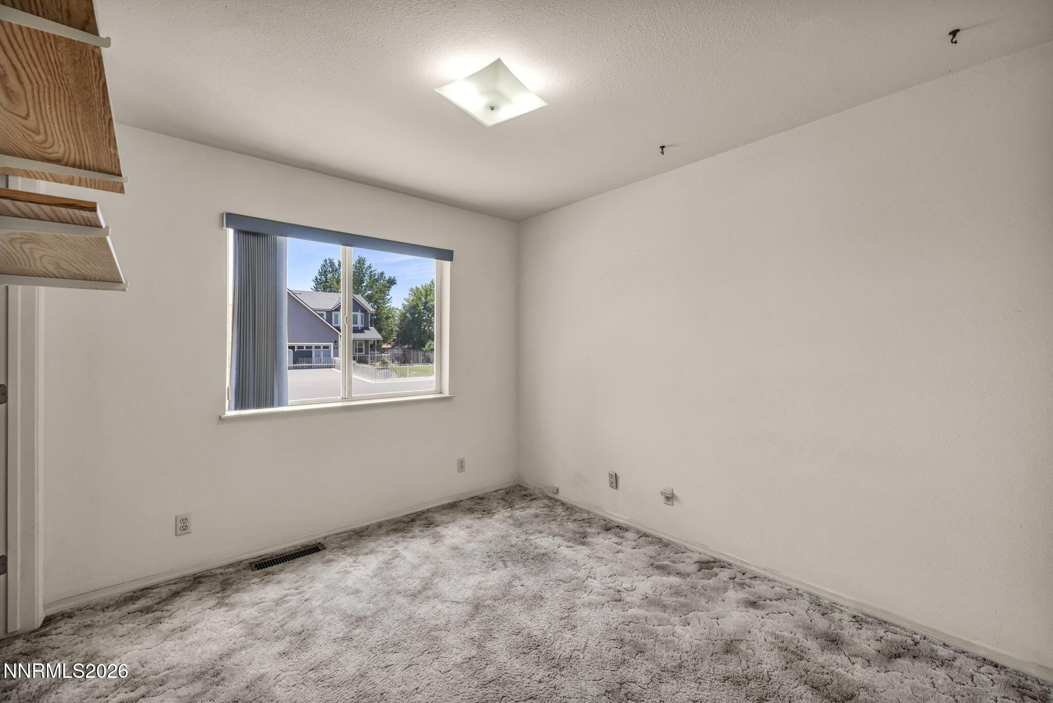 692 Lassen Way Gardnerville, NV 89460 - Photo 24 of 34 a view of an empty room with a window
