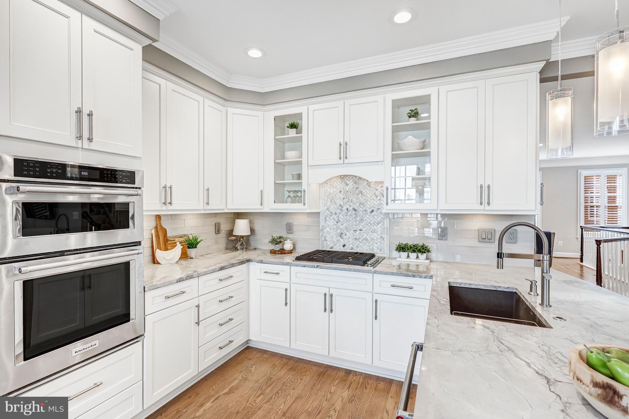 17 Alexander Street Alexandria, VA 22314 - Photo 12 of 30 a kitchen with appliances a sink and cabinets
